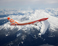 The new Boeing 747-8 Intercontinental soars above snow-capped mountains in Washington state during its first flight.

The 747-8 Intercontinental will have the lowest seat-mile cost of any large commercial jetliner, with 12% lower costs than its predecessor, the 747-400. The airplane provides 16% better fuel economy, 16% less carbon emissions per passenger and generates a 30% smaller noise footprint than the 747-400. 